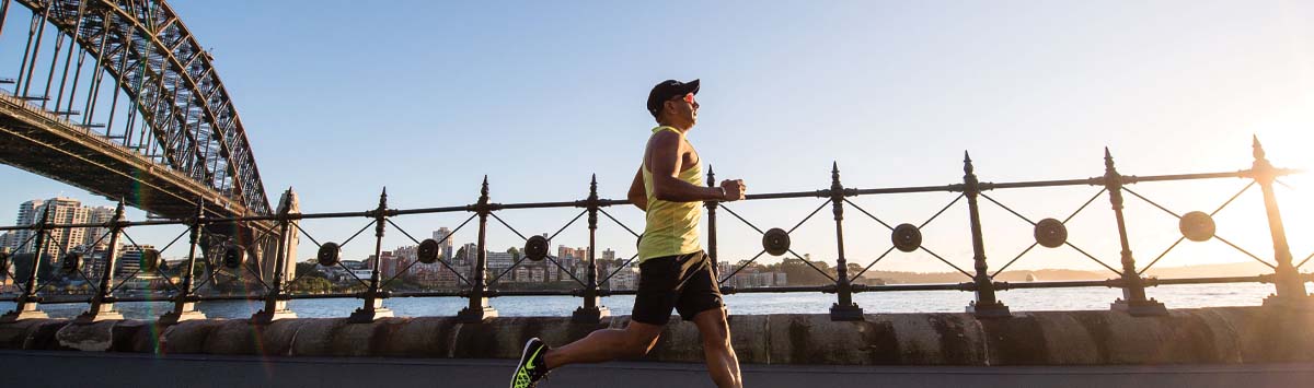 man running on bridge